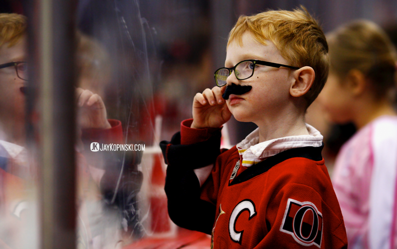 OTTAWA, CANADA - November 28: A young Senators fan sporting his Movember moustache before a  game between the Canucks and Senators at the Canadian Tire Centre on November 28, 2013 in Ottawa, Ontario, Canada. ***** Editorial Use Only ***** Jay Kopinski - Icon SMI