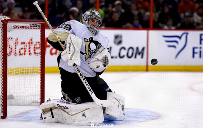 OTTAWA, CANADA - December 23 : Pittsburgh Penguins Goalie Marc-Andre Fleury (29) [3395] with a save during a game between the Penguins and Senators at Canadian Tire Centre on December 23, 2013 in Ottawa, Ontario, Canada. ***** Editorial Use Only *****Jay Kopinski-Icon/SMI