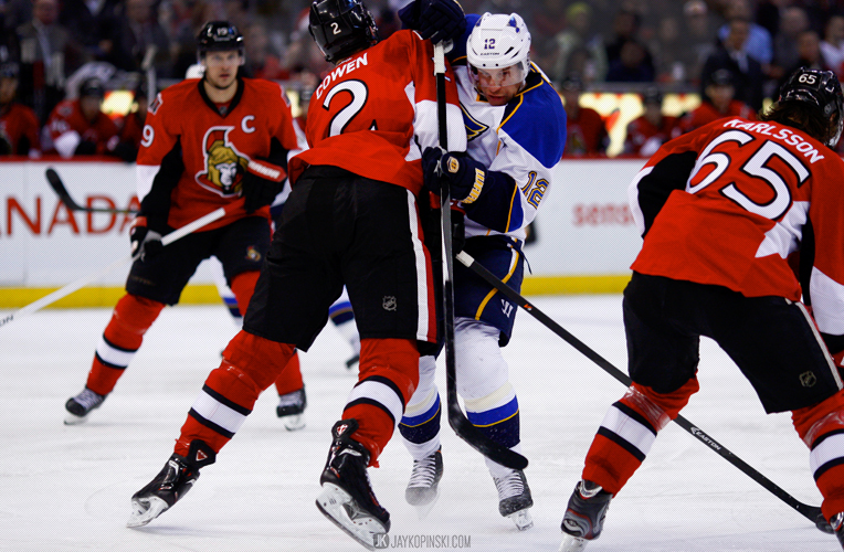 OTTAWA, CANADA - December 16: Ottawa Senators Defenceman Jared Cowen (2) [7115] with a hit on St. Louis Blues Left Wing Derek Roy (12) [2162] during a game between the Blues and Senators at Canadian Tire Centre on December 16, 2013 in Ottawa, Ontario, Canada. ***** Editorial Use Only ***** Jay Kopinski-Icon/SMI