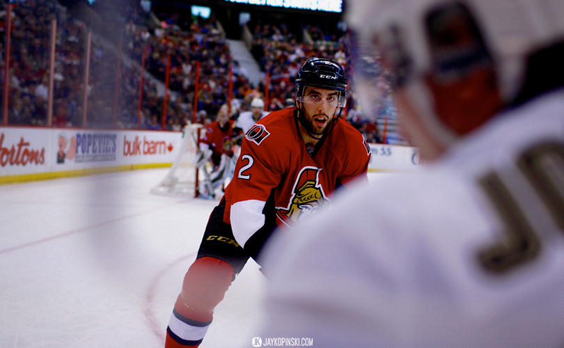 OTTAWA, CANADA - December 23 :Ottawa Senators Defenceman Jared Cowen (2) [7115] moves in for a big hit along the glass during a game between the Penguins and Senators at Canadian Tire Centre on December 23, 2013 in Ottawa, Ontario, Canada. ***** Editorial Use Only *****Jay Kopinski-Icon/SMI